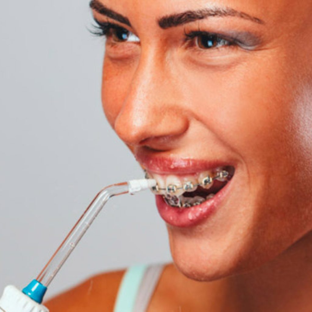 como usar el irrigador dental